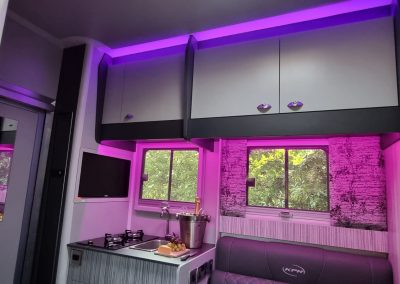 Aeos Discovery 45 - Full living with pink lighting